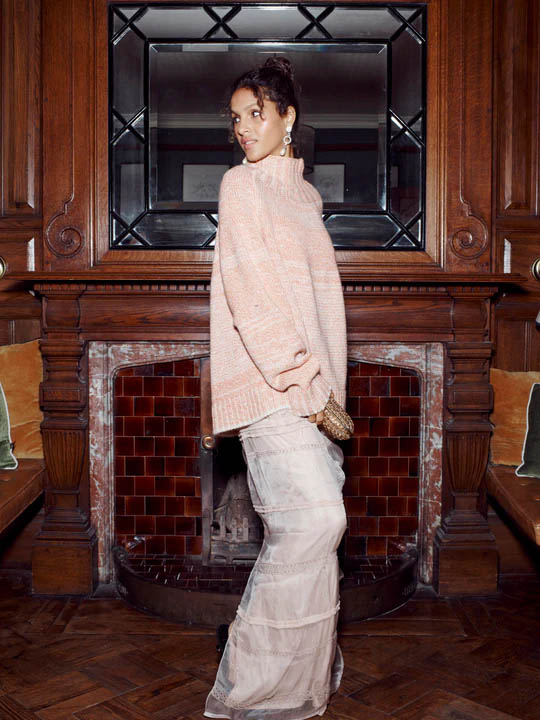 Woman wearing a pink knit jumper